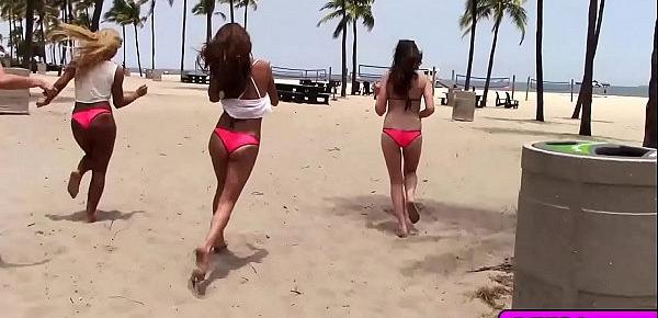  Sexy beach babes enjoy a hot group fucking action